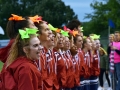 Junior Kailey Dunivan sings the Manhattan High School alma matter during the beginning of the MHS Varsity football homecoming game. At the start of every game the MHS cheer team leads the school in the alma matter, pumping up the crowd and showing school spirit. Homecoming week is filled with spirit days, a pep rally, the football game all leading up to the homecoming dance on Sep 29. Photo by Hailey Eilert