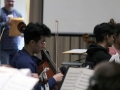 Senior Chris Chae sits in the first round of All-State rehaersal after auditioning for chair placements that morning. The rehearsal combined other students from Kansas who all played a piece specifically composed for their Saturday performance. Photo by Sophia Comas
