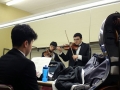 Juniors Brent Sol and Joshua Fan practice thier violin parts as senior Chris Chae studies his music in their dressing room. The group used their time in Witchita to rehearse for both their KMEA and All-State performaces that Friday and Saturday. Photo by Sophia Comas