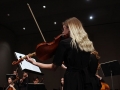 Senior Grace Hart rocks with the beat of String Quarttet No. 8, moving her body with each note to express the anger behind them. The piece, written by Dmitri Shostaovixh in the time of Stalin, expressed his sadness and rage toward those who practiced fascism. Photo by Sophia Comas