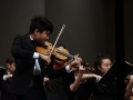 Senior Allen Zhang plays intensely to Shostakovich's String Quartet No. 8, which is meant to express both the sadness and anger he felt during the World War II era. His self-written requiem required that the Chamber Orchestra play aggresively, resulting in broken bow strings. Photo by Sophia Comas