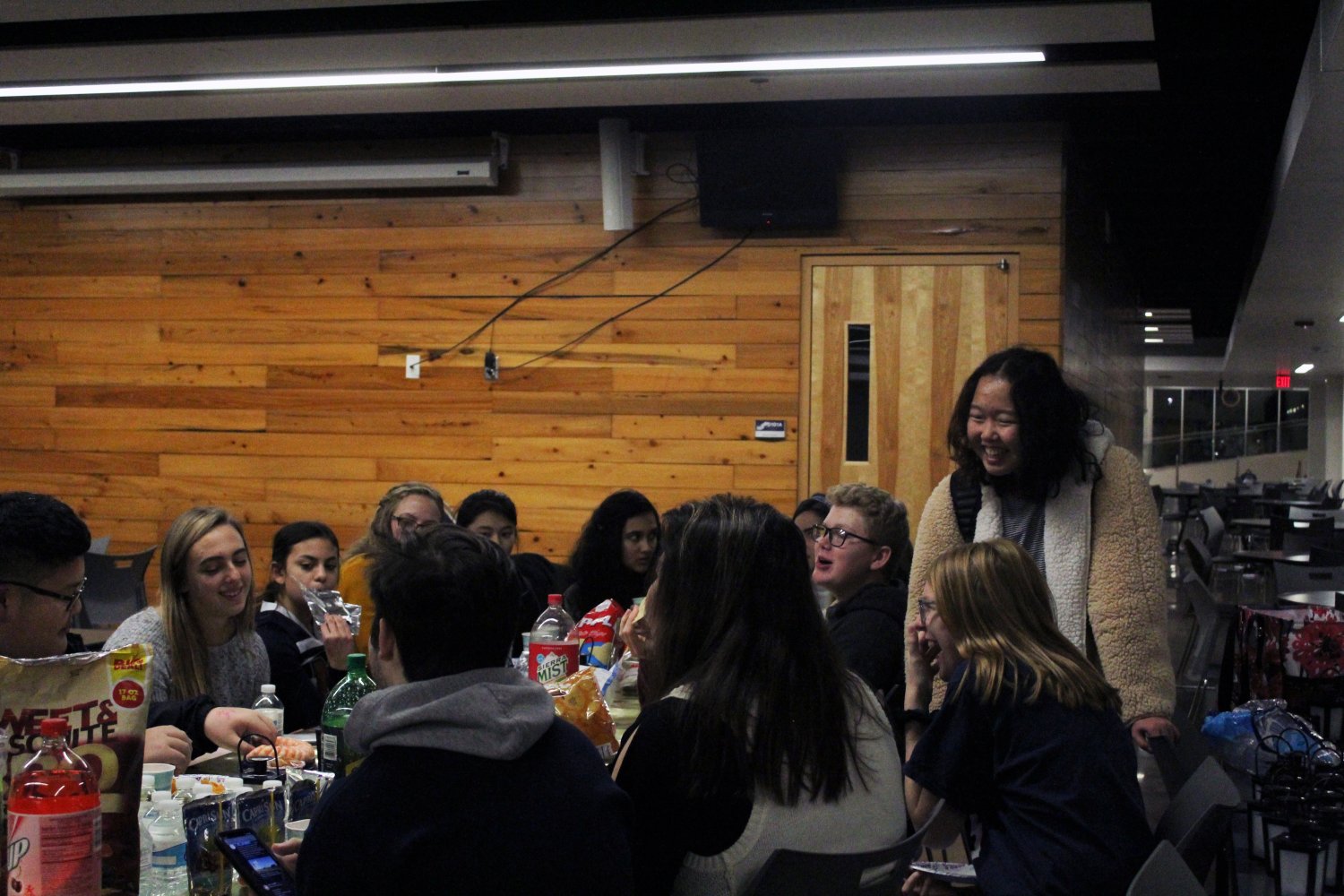 Members of many different clubs joke and laugh together as they enjoy their food at the StuCo club feast. 
Photo by Kyla Barnett
