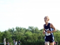 THIRD ZOOMER Freshman Marshall Garren zooms past as Manhattan's third lead runner. Garren placed third with a time of 18:38.2, having ran a 5K at the Warner Park meet on September 7. The Boys Junior Varsity team placed first with a score of 19, Garder-Edgerton second with 68. Photo by Julianna Poe