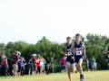 THREESOME RUNNERS Freshman Kolby Grogg leads with seniors Brian Dudley and Ian Percival close behind. All three boys finished within about a second, Grogg placing sixth with a time of 19:20.4, Dudley seventh with a time of 19:20.5 and Percival eighth with a time of 19:21.6, each running 4K. Overall, the Boys Junior Varsity team placed first with a score of 19 -- Gardner-Edgerton second with 68 -- at the Warner Park meet on Septemeber 7. Photo by Julianna Poe