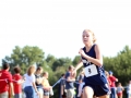 ZIPPY JUNIOR Junior Josie Knoppes zips past the finish line as Manhattan's second lead runner. McCollough placed second with a time of 18:05.1, having ran a 4K at the Warner Park meet on September 7. The Girls Junior Varsity team had an overall score of 21, Seaman second with 35. Photo by Julianna Poe