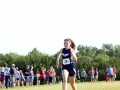 AMAZING ASHLEY Freshman Ashley Call zips toward the finish line, leading as Manhattan's 13th runner. Call finished with a time of 21:53.4, having ran a 4K at the Warner Park meet on September 7. Photo by Julianna Poe