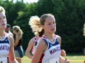 SPEEDY STRIDERS Sophomore Halle Gaul and freshman Saylor Salmans stride together as they push to finish a 5K. "I felt the strength and support of my teammates as we were pushing through the race togther," Gaul said. Gaul placed 15th with a time of 21:59.3 while Salmans placed 20th with a time of 22:16.5. Overall, the Girls Varisty team placed first with a score of 37, Emporia second with a 79. Photo by Julianna Poe