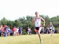 SOPHOMORE SPRINTER Sophomore Jenna Keeley zips past the finish line as Manhattan's third lead runner. Keeley placed fifth with a time of 20:50.3, having ran a 5K at the Warner Park meet on September 7. Overall, the Girls Varisty team placed first with a score of 37, Emporia second with a 79. Photo by Julianna Poe