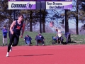 Jolted Jumper. Junior Chandler Marks gets supported as he attempts the six foot mark on the high jump at Bishop Stadium. Marks cleared six feet but didn't clear the next standard. The meet took place on Apr. 12. Photo by Mason Alberto.