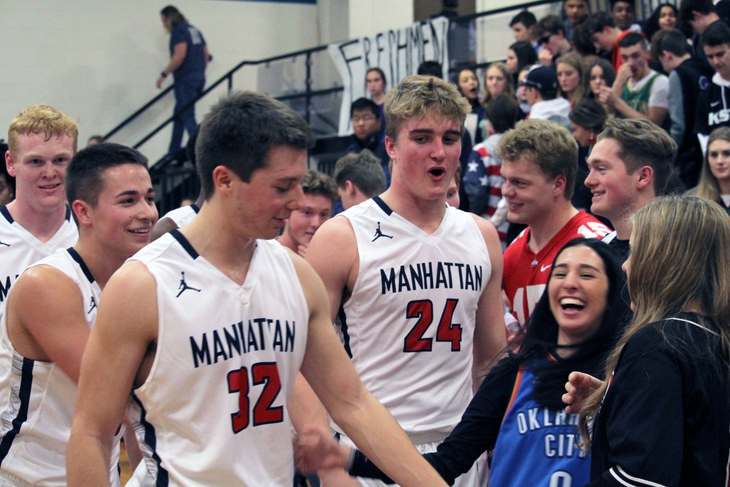 Sweet Success. The MHS Basketball team laughs with friends from the crowd.