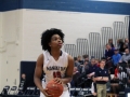 Raeshon Riddick prepares to take a shot during warm up, preparing for the game against Seaman Highschool.