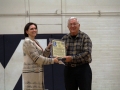 Dave Fiser recieves an alumni award at the halftime of the MHS vs Seaman basketball game.