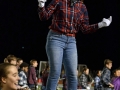 Senior Maggie Fontinini snaps to the beat as the MHS Big Blue Marching Band heads off the field at the end of their halftime performance. Fontini is a second-year drum major, other drum majors for the band this school year are seniors Jayna Schwartz and Josh Brandt. Photo by Hailey Eilert