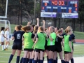 The girls soccer team gets hyped-up for their game against Topeka High.