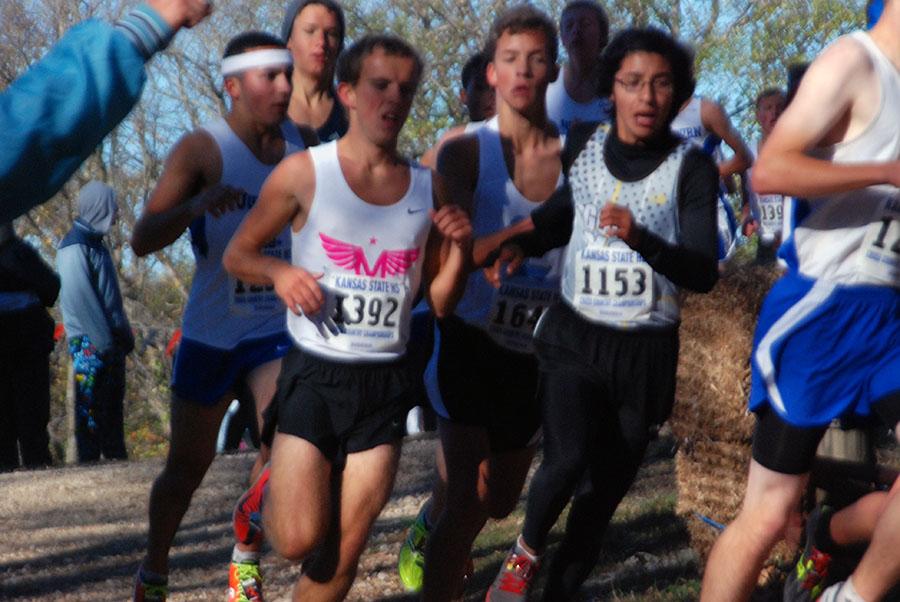 Junior Sam Morgan surges around a corner to pass opponents in his race.