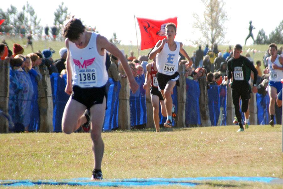 Junior Peter Gruenbacher crosses the finish line.