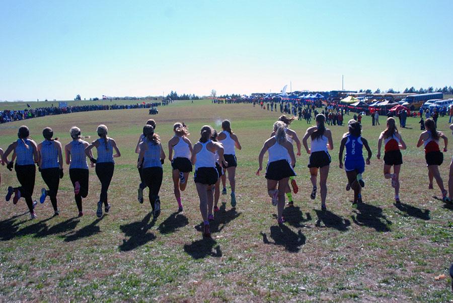 The girls team sprints out at the start of the 4k race.