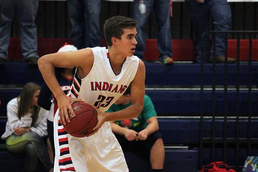 Graduate Pierson McAtee looks for an open teammate Dec. 16, 2014, against Great Bend in Manhattan.