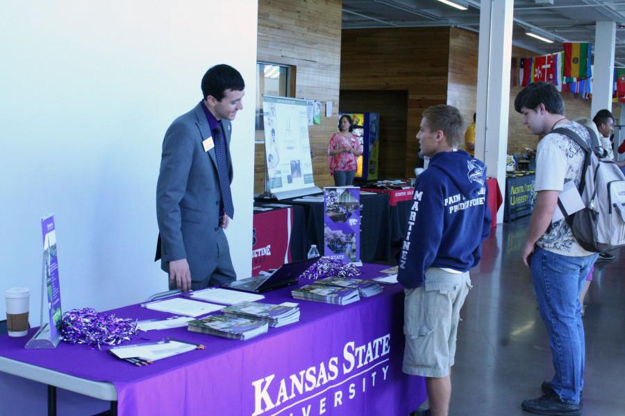 Senior+Alejandro+Martinez+talks+with+the+Kansas+State+University+College+representative+Landon+Leiker+about+appling+to+K-State+during+the+College+Fair%2C+on+Monday+October+12.