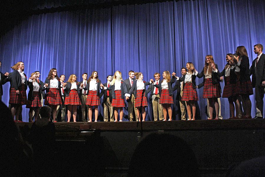 The Varsity Choir bows after their two song performance last Wednesday in Rezac Auditorium.