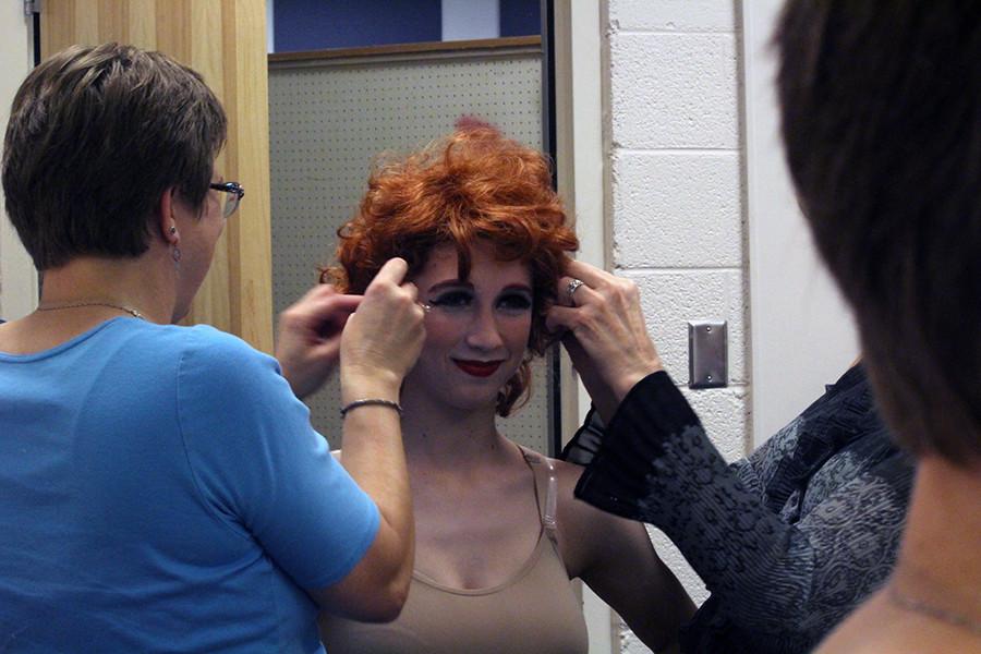 Senior Emma Galitzer is fitted for her wig for her character, Adelaid. Galitzer has one of the main roles in Guys and Dolls but said she has been handling it well.
