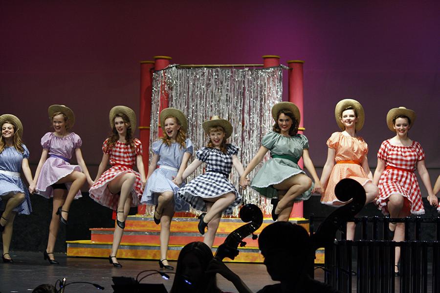 Dancing in their club, the girls of the Hot Box-Nightclub skip and sing about love with the song "Bushel and a Peck."