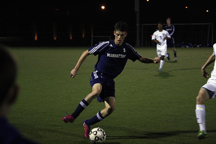 Senior Gardner Blanck looks to keep the ball inbounds against Wasburn Rural defenders Tuesday night in Topeka.