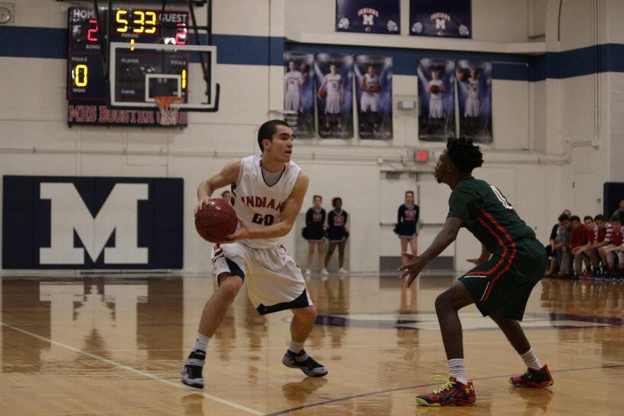 Senior Gabe Awbrey surveys the Highland Park defense Friday night. Awbrey iced the game with 8-of-10 free throws in the fourth quarter in the Indians 60-55 win.