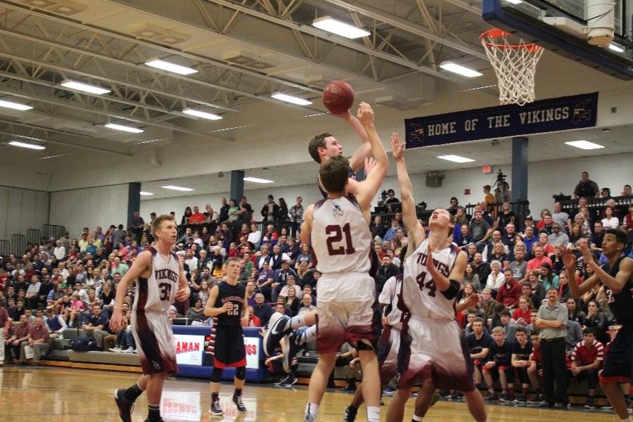 Senior Grant Munsen goes up for a floater in his team's win over Seaman Friday night.