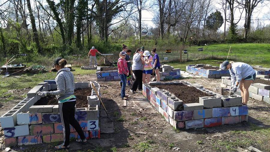 Stacking cement blocks, and buliding planters in the gardens aroudn Memphis, Tenn. is how the memebers of the University Christian Church's youth group spent their spring break helping others.