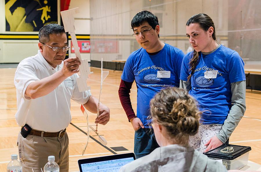 Senior Mackenzie Gwinner and junior Owen Li wait as the airplane they designed and created is measured by an official at the state competition last Saturday at Wichita State University. The pair’s plane went on to take first in the Wright Stuff event. “For Wright Stuff, once we got there I knew from watching the other teams flights that we would do fairly well and place in the top three at least,” Li said. We were pretty close to taking State last year, so we thought winning the whole thing was reasonable and we were so close to it.”