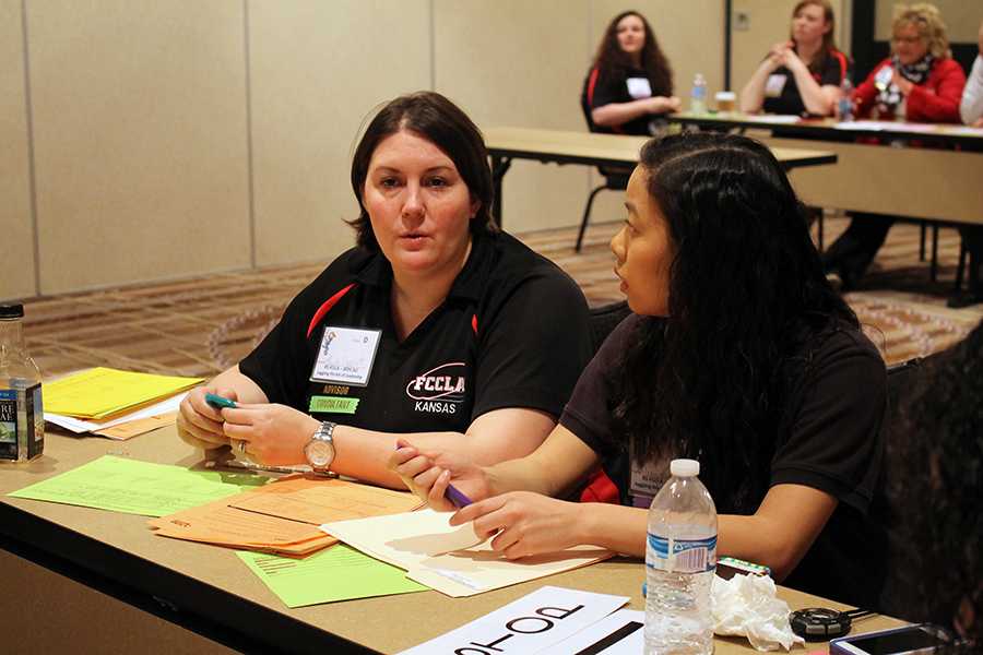 Sophomore Anna Hastings works with Family Career Community Leaders of America sponsor Heide Rippert to judge and time events at FCCLA state.