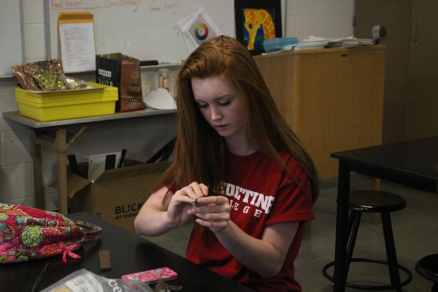 Savannah Barron works on her jewelry in her 7th hour jewelry class. Barron is one of the freshmen that come up to the west campus to work on their projects