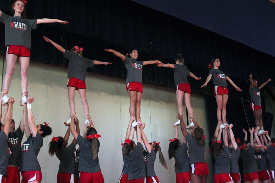 Varsity and junior varsity members practice their complex and different routine, with only a small handful af practices left before their performance at the winter pep rally.