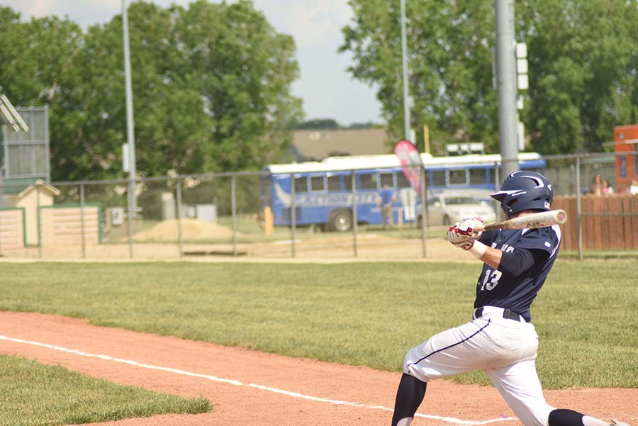 Swing and miss. Senior Chance Henderson follows through on his swing after missing the ball. 