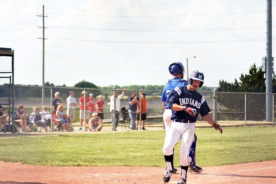 On the board. Senior Jake Steinbring runs home off of an error by Junction City's third baseman. Steinbring scored one point helping lead the Indians to the win.