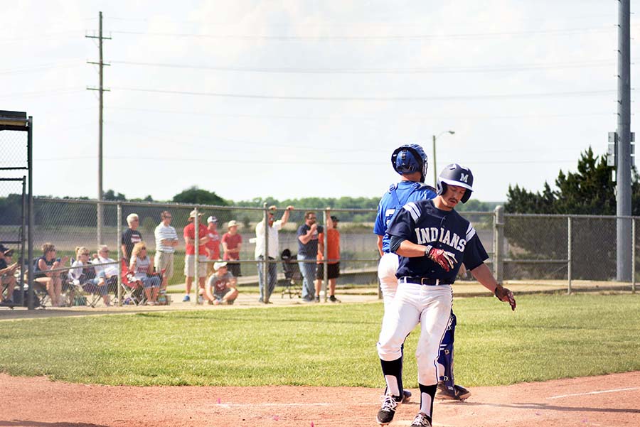 On the board. Senior Jake Steinbring runs home off of an error by Junction Citys third baseman. Steinbring scored one point helping lead the Indians to the win.