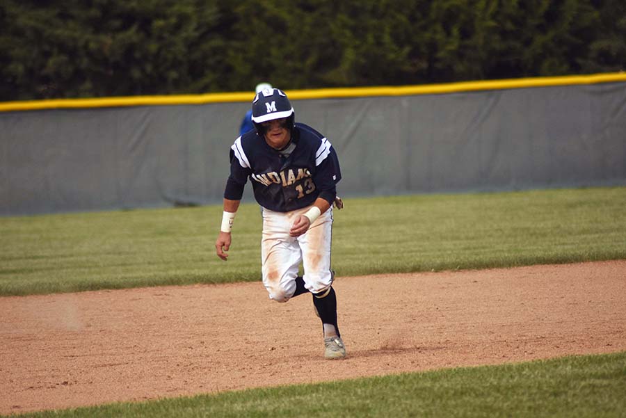 Leading off. Senior Chance Henderson leads off of the bag in hopes of stealing second base. Henderson went 2-3 at the plate.