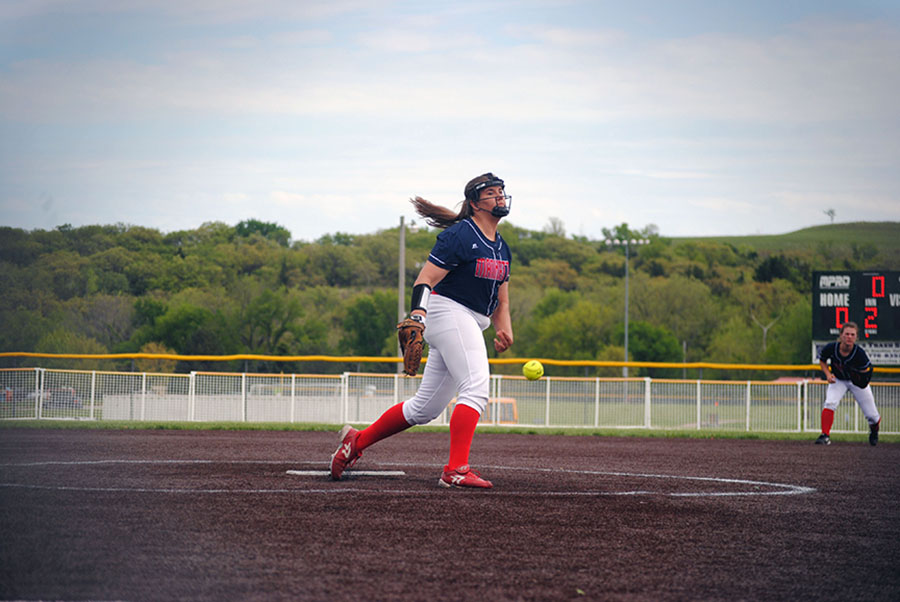 Junior Anna Batt releases a pitch against Shawnee Heights. Manhattan lost 4-1 to fall to 6-10 on the season.