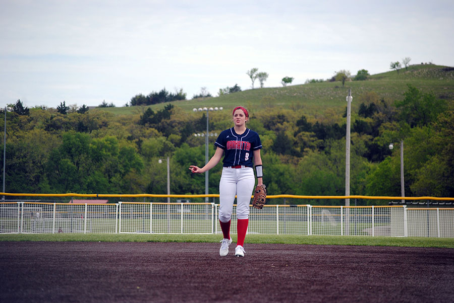 Junior Josie Hilgers motivates the team to get one final out.