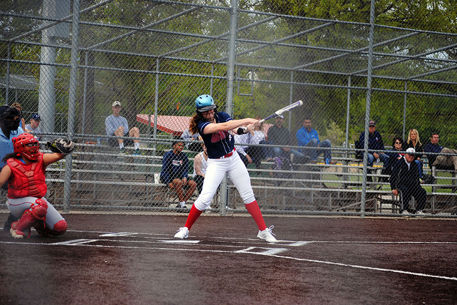 Junior Josie Hilgers swings, and misses, at a pitch. Manhattan lost 4-1 against undefeated Shawnee Heights.