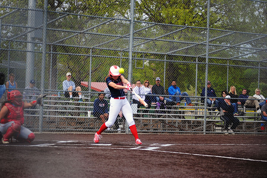 Junior Madisyn Shaneyfelt nicks the ball foul. Shaneyfelt caught the first game, a 4-1 Shawnee Heights victory.