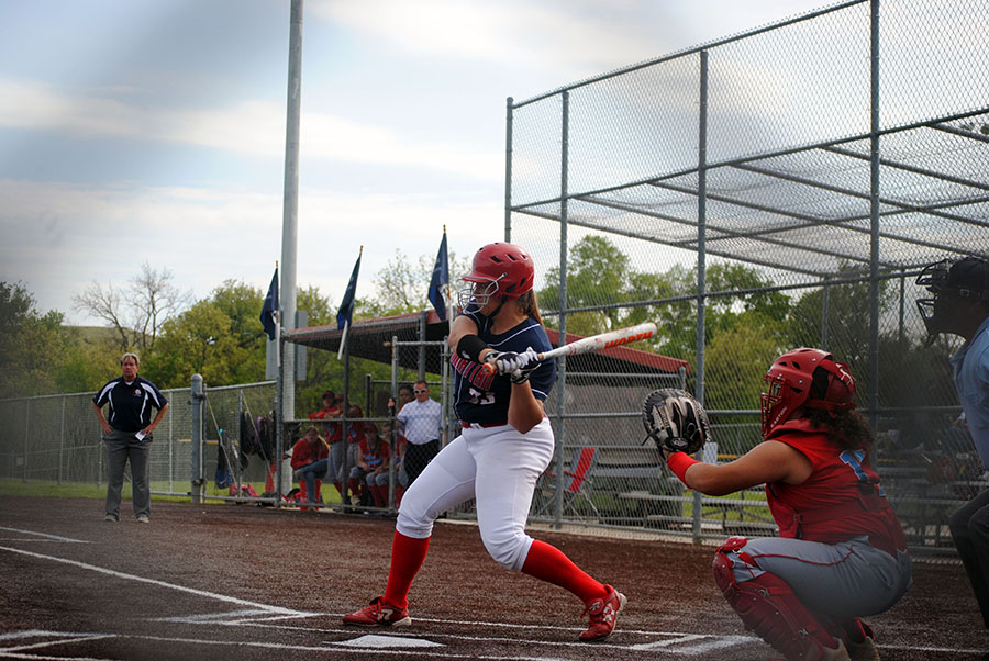 Junior Anna Batt swings her bat to make contact with the ball. Batt also pitched Manhattans 4-1 loss.