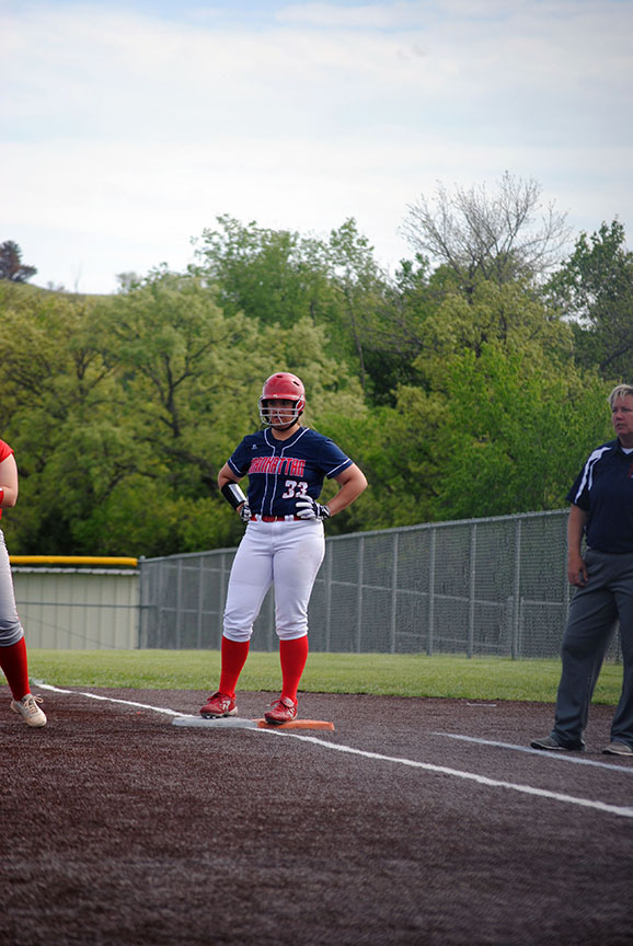 Junior Anna Batt stands on first after hitting safely.