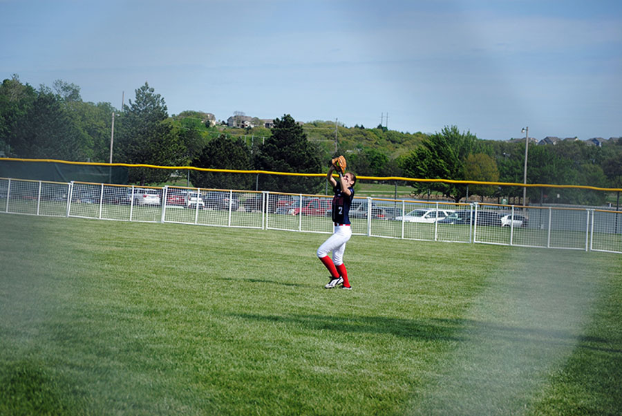 Freshman Ruth Shinstock catches a fly ball from Shawnee Heights. Shinstock is one of many freshmen starting on Varsity.