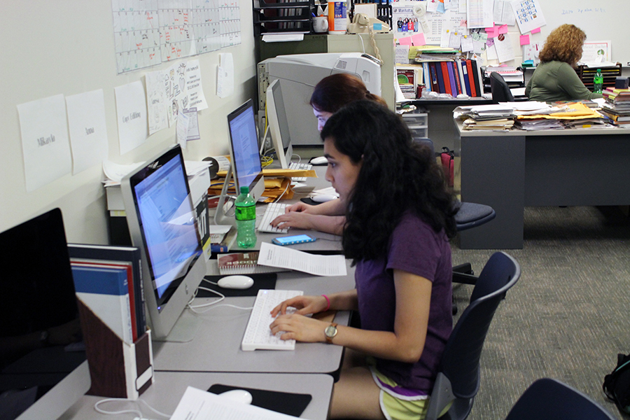 Freshman Mira Bhandari and junior Elizabeth Alexander proof their newspaper stories during class. Newspaper stories go through a process of being assigned, interviews being taken, transcribed and then put into the story. The story then gets proofed by editors before being placed onto the page on work nights.