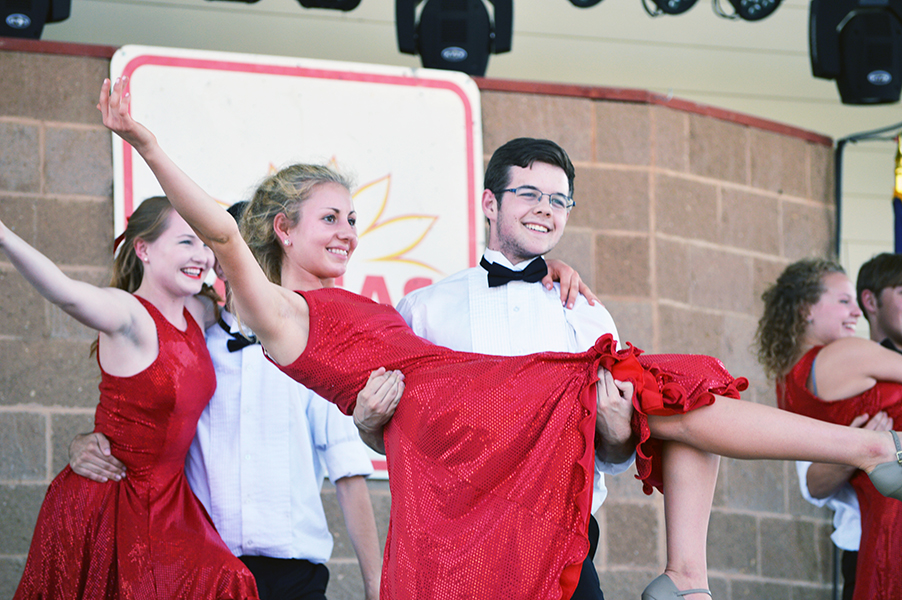 Junior choir students Parker Wilson and
Emily Knapp perform with smiling faces in
front of their Kansas State Fair audience.
During this performance, male leads carried
their female counterparts and spun
them around. 