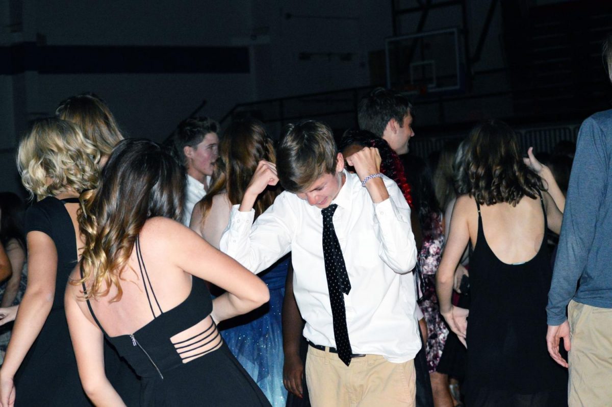 Seniors Cooper Schroeder and Addy Stone dance at homecoming. The dancing with all my friends and listening to the music was my favorite part, also not having to put up with the stress of a regular day, Schroeder said.