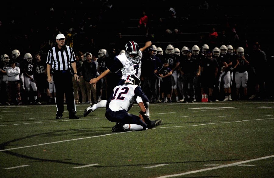 Senior Thomas Gevock runs up to kick an extra point. Gevock was perfect on extra points on the night, making all six of his opportunities. Gevocks leg helped the Manhattan defense as well, as he recorded four touchbacks. 
