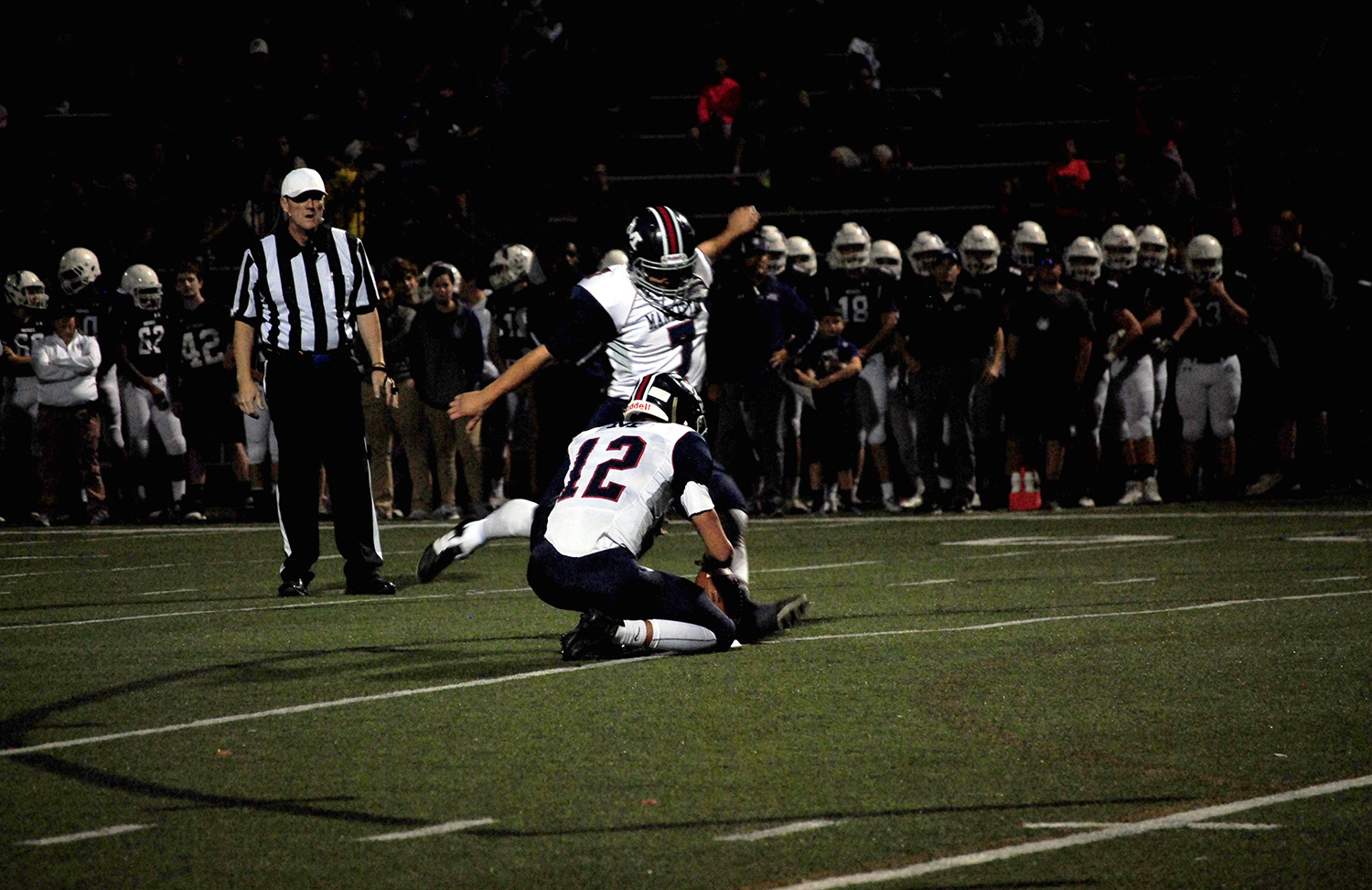 Senior Thomas Gevock runs up to kick an extra point. Gevock was perfect on extra points on the night, making all six of his opportunities. Gevock's leg helped the Manhattan defense as well, as he recorded four touchbacks.